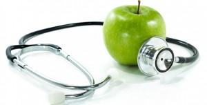 protect your health with healthy nutrition.Stethoscope, apple